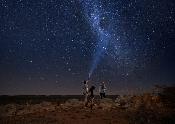 Couple star gazing beneath the Milky Way at Outback Astronomy Couple star gazing beneath the Milky Way at Outback Astronomy