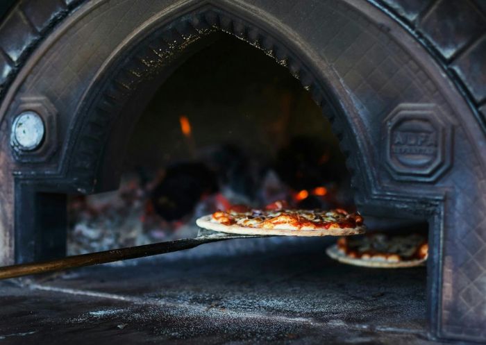 Four Winds Vineyard Cellar Door, Murrumbateman - Credit: Four Winds Vineyard Cellar Door Pizza from the wood fire oven at Four Winds Vineyard Cellar Door, Murrumbateman