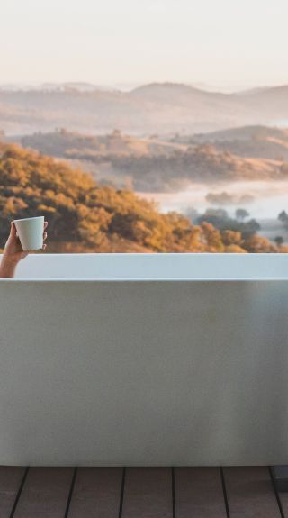 Woman enjoying her stay at Sierra Escape, Piambong near Mudgee