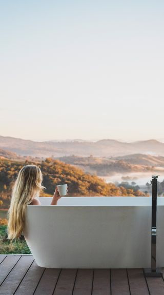 Woman enjoying her stay at Sierra Escape, Piambong near Mudgee